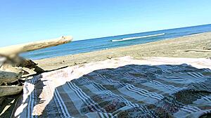 Shameless European nympho caught on camera while Masturbating on nude beach