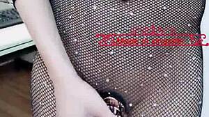 Xingzifei, a sexy Chinese shemale, wears black silk stockings and flaunts her penis outdoors.