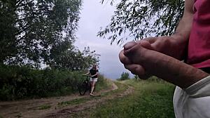 A man exposes himself in a public place and masturbates in front of a woman he doesn’t know.